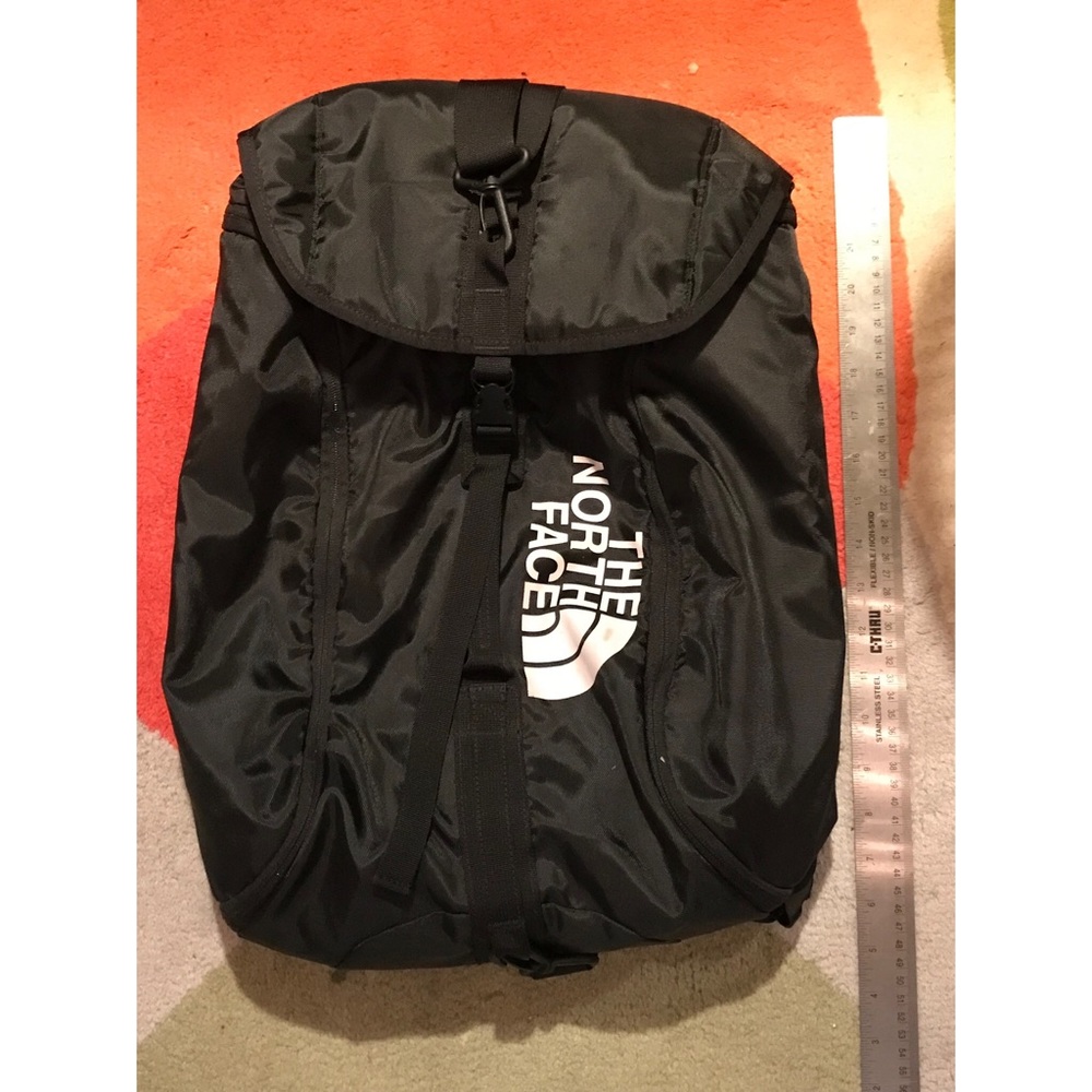 The NORTHFACE Black backpack with hideaway strapes